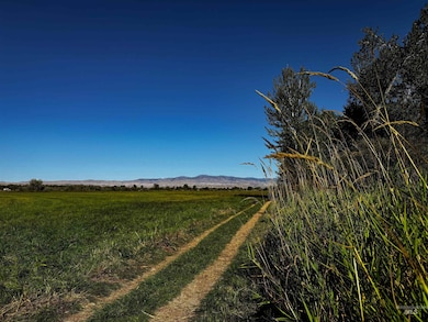 View of yard featuring a rural view and a mountain view