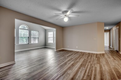 Unfurnished room featuring a textured ceiling, cei