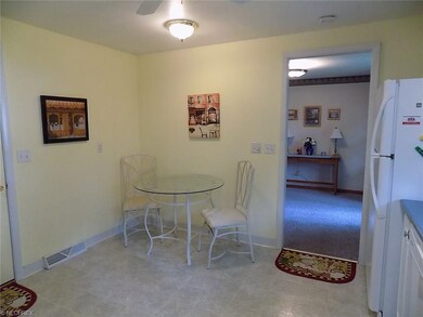 Eat-in kitchen, doorway to dining room.