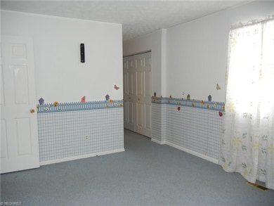 Master bedroom with closet and hall to bath.