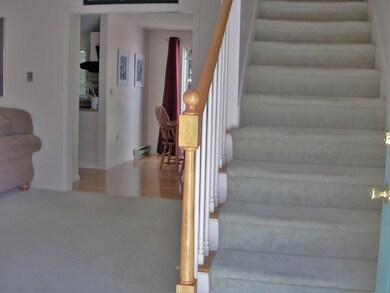 Stairs to second level with living...