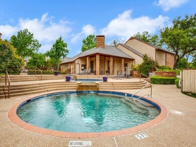 Community pool with a patio