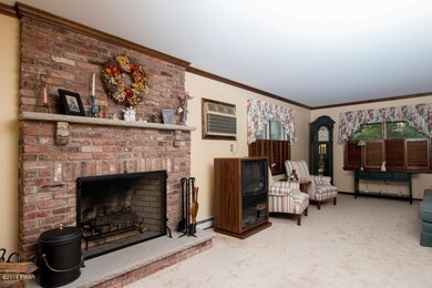 Living room w/ brick fireplace