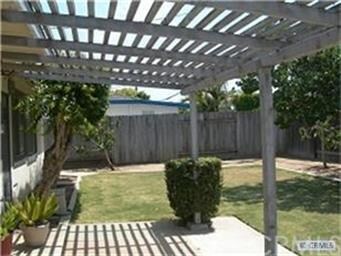 Back yard w/covered patio.