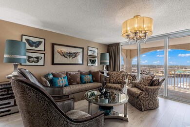 Living room featuring a textured ceiling, light wo