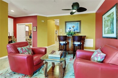 Living area with crown molding, and ceiling fan