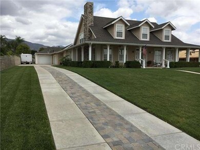 Long driveway to garages.