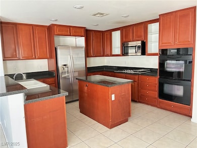 Kitchen with appliances with stainless steel finis