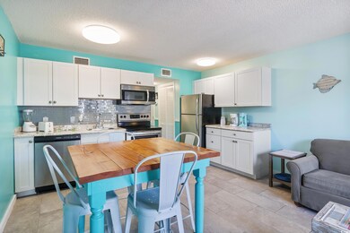 Kitchen with a textured ceiling, stainless steel a