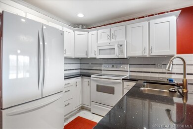 Custom cabinet fronts, tile backsplash