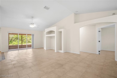 Unfurnished room featuring arched walkways, ceilin