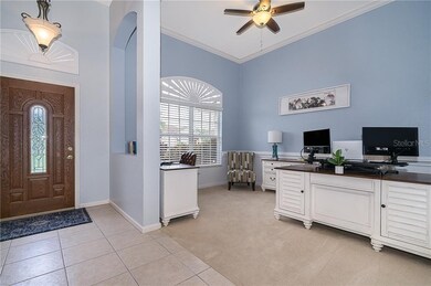 Front door with office/bonus room area on your lef