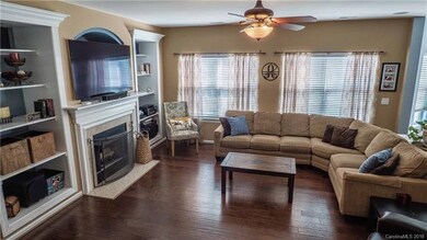 Great room has built-ins and gas log fireplace.