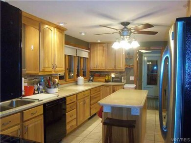 Kitchen. Beautiful updated cupboards made by Kitchen World.  Center Island has electric!