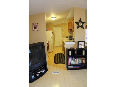 Living Room. View into kitchen shows just how clea