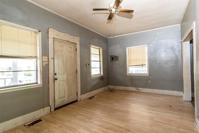 Foyer entrance featuring ornamental molding, ceili