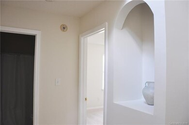 Foyer and hallway to secondary bedrooms.