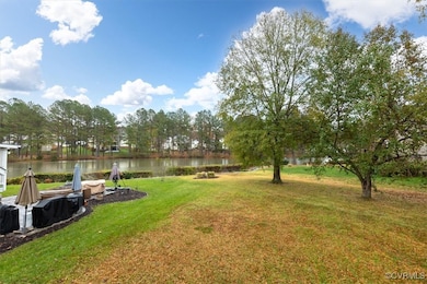 View of yard with a water view