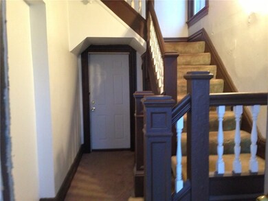 Common entry way.  Door leading to 1st floor apartment stairs lead to 2nd floor.  Basement access available too.