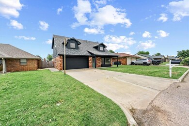 View of front of property with brick siding, concrete driveway, an attached garage, and a shingled roof