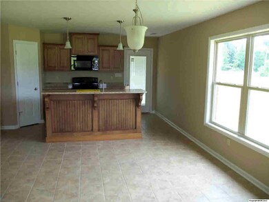 FAMILY ROOM LOOKING INTO EAT-IN AND KITCHEN!