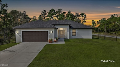 View of front of property featuring stucco siding, driveway, an attached garage, roof with shingles, and a gate
