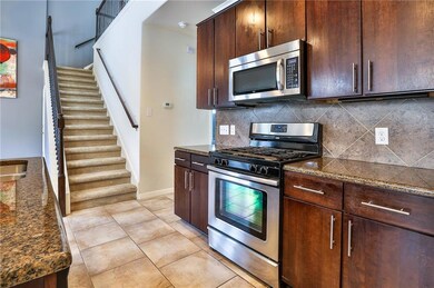 Kitchen with stainless steel appliances, decorati