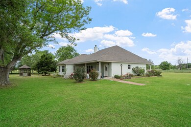 Enjoy the peaceful backyard surrounded by mature t