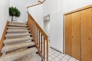 One of the two closets in entry; garage entrance to the right.