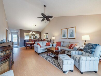 Living room featuring ceiling fan with notable cha