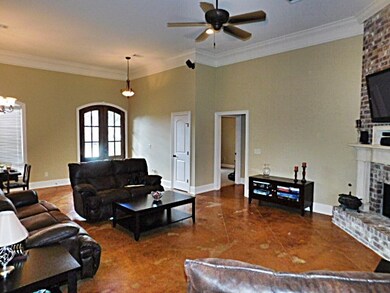 Family room has brick, gas log fireplace