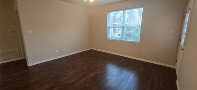 Empty room with dark wood-type flooring and ceilin