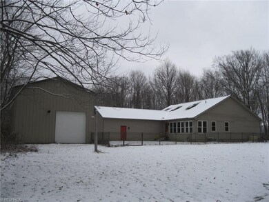 Back side of house and Mammoth Garage! Fenced in p