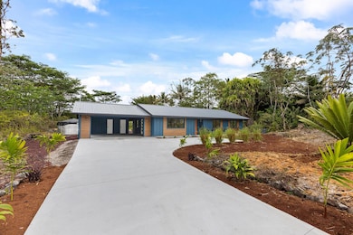 This attractive front approach has a full width finished concrete driveway with turnaround and attractive landscaping.