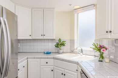 The kitchen features a good amount of cabinets.