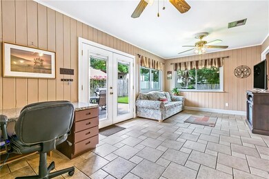 Open living room over looking beautiful backyard.