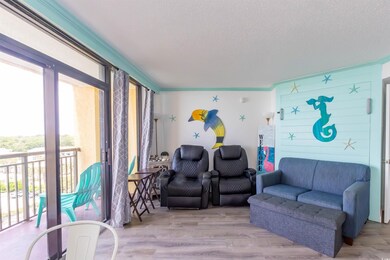 Living area with light wood finished floors and a 