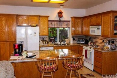 Kitchen view from Family room.  Granite counter to
