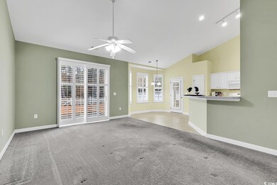 Unfurnished living room featuring light carpet, hi