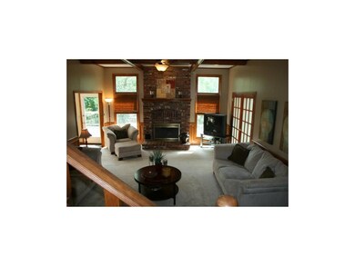 Open and airy great room with floor to ceiling win
