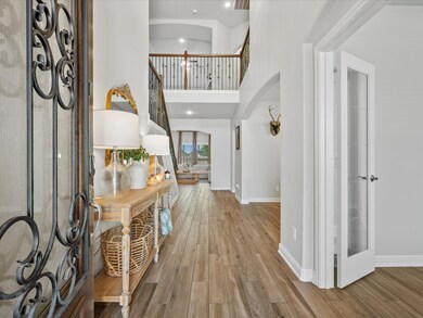 Upon Entry, you're greeted with soaring ceilings, added chandelier and much natural lighting all the way to the back of the home!