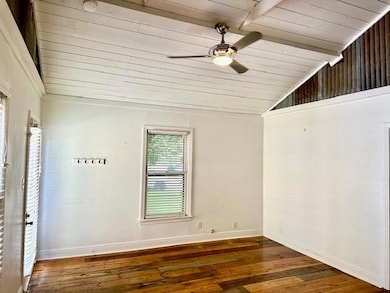 Unfurnished room with wooden ceiling, lofted ceil