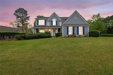 Traditional home featuring a front yard