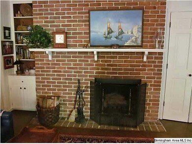 Den fireplace.