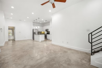 Unfurnished living room featuring baseboards, rec