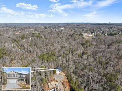 Aerial view of property and surrounding area featu