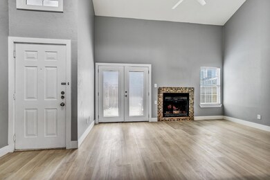 Unfurnished living room featuring wood finished f