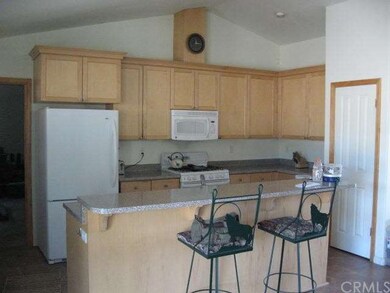 Kitchen with propane range and counter top eating 