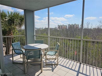 Sunroom / solarium featuring a city view