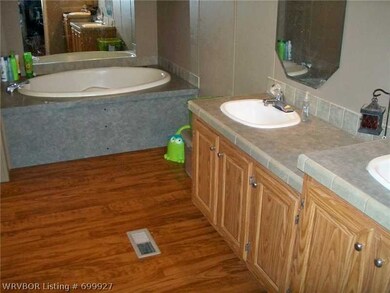 Master Bath/Spa. Garden tub, walk in shower, double sinks, and walk in closet